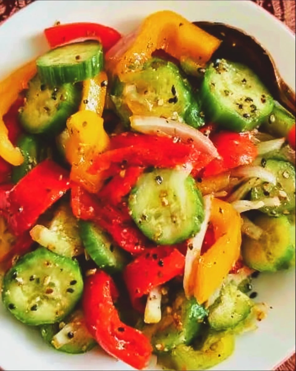 Viral TikTok cucumber and bell pepper salad served in a bowl